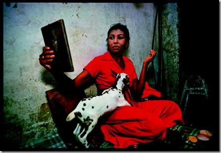 Champa, a transvestite, with his pet goat, getting dressed for the night