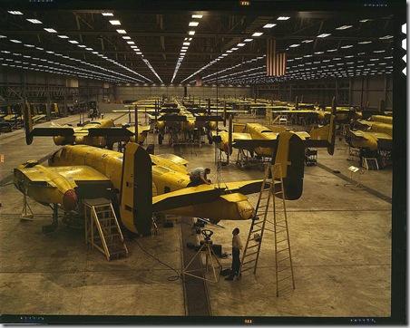 Assembling B-25 bombers at North American Aviation. Kansas City, Kansas, October 1942. Reproduction from color slide. Photo by Alfred T. Palmer. Prints and Photographs Division, Library of Congress