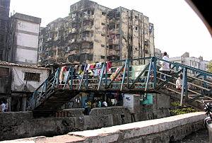 An entrance to the largest slum in Mumbai, and...