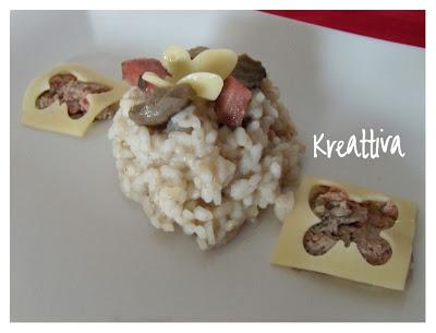 Risotto tartufato con mortadella e farfalle di fettine