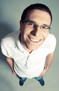 2344376-215007-isolated-close-up-of-a-cheerful-young-man-looking-up-top-view-indoor
