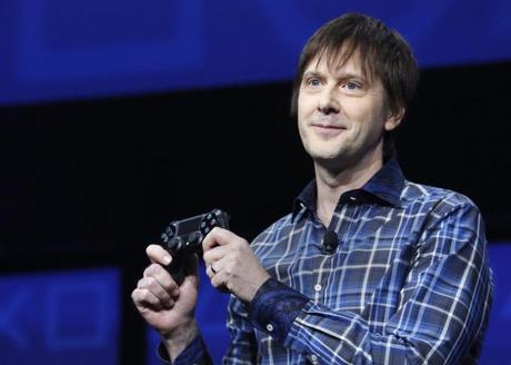 PlayStation 4's lead system architect Mark Cerny holds a gaming control device in New York