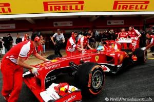 2013-Spanish-GP-Alonso-wheeled-into-the-garage