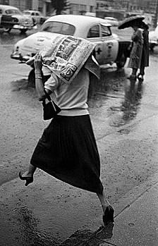 vintage-city-newspaper-rain-woman.jpg