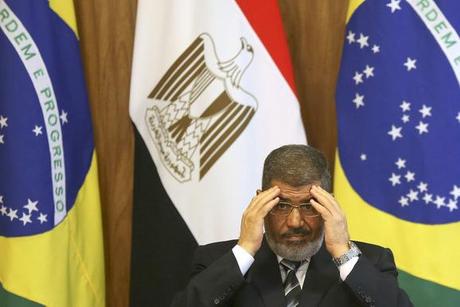 Egypt's President Mohamed Mursi attends a signing ceremony with Brazil's President Dilma Rousseff at the Planalto Palace