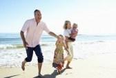 18718939-grandparents-and-grandchildren-enjoying-beach-holiday