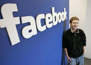 Mark-Zuckerberg-by-Facebook-sign