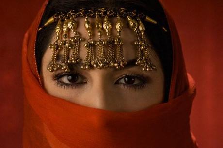 Middle Eastern woman in ornate headdress