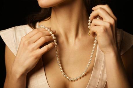 Woman wearing pearl necklace