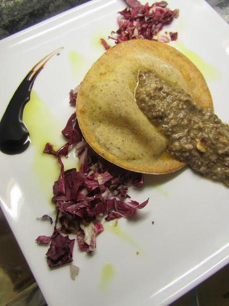 Raviolone di Saraceno robiola e tartufo con pesto di trevigiana e nocciole.