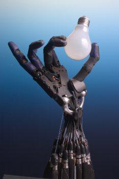 Image of a robotic hand with a bulb