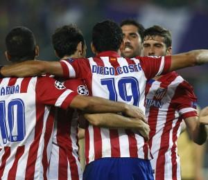 Atletico Madrid players celebrate scoring against Austria Vienna, during their Champions League match in Vienna