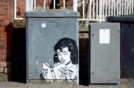 Girl Reading. Street art in Gloucester