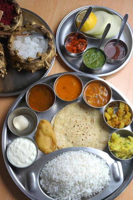 Indian thali - meal made up of a selection of various typical dishes including rice, dal, vegetables, roti, papad, curd (yoghurt), small amounts of chutney or pickle, and a sweet dish to top it off.Thali dishes vary from region to region and are usually served in small bowls, called katori, which are placed on a round tray, the actual thali - often a steel tray made with multiple compartments is used. #food #culture #india #cuisine