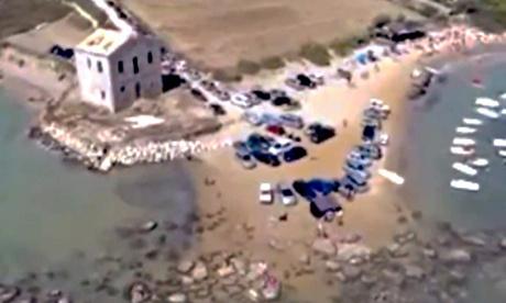 Drone video made by MareAmico of cars parked on the Sicilian beach