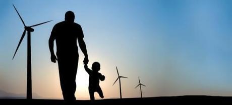 energy-renewable-man-and-baby-walking-toward-wind-turbines
