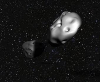 Che taglia porta l’asteroide? La coppia di asteroidi Patroclus-Menoetius, nel rendering di un artista.