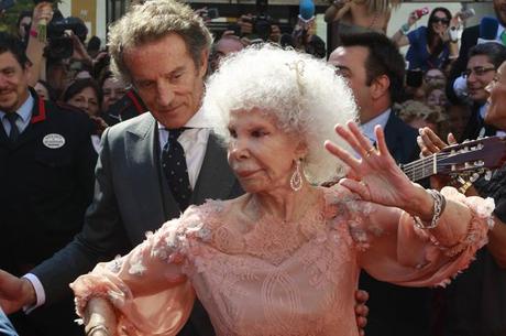 File photo of Spain's Duchess of Alba Cayetana Fitz-James Stuart y Silva dancing flamenco beside her husband outside Las Duenas Palace after their wedding in Seville