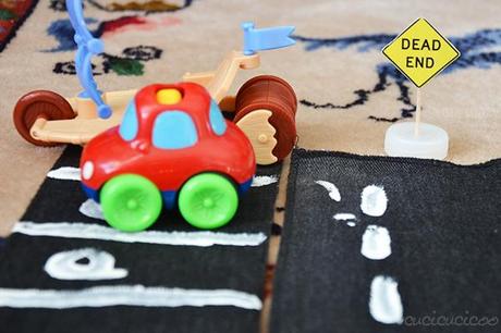 Three DIY street toys from repurposed materials for kids who love cars! Toy streets, street signs and a stoplight | www.cucicucicoo.com