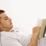 man-reading-book-in-bed-393d0