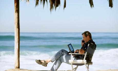 Using Cell Phone and Laptop on Tropical Beach