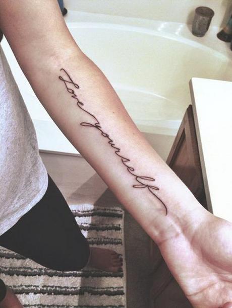 cursive-font-rib-tattoo-8