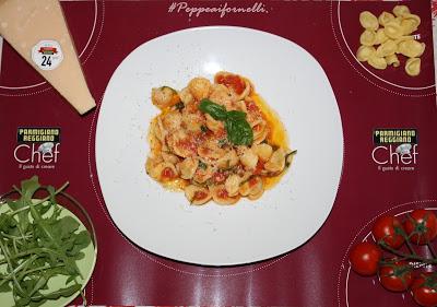 Orecchiette baresi con rucola, pomodorino e Parmigiano Reggiano .