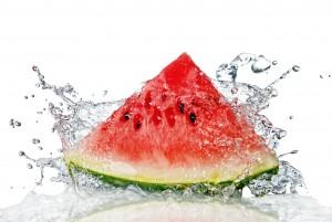 watermelon and water splash isolated on white