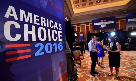 Journalists speak back stage ahead of the Democratic presidential debate at the Wynn Hotel in Las Vegas, Nevada on October 13, 2015, hours before the first Democratic Presidential Debate. After ignoring her chief rival for months, White House heavyweight contender Hillary Clinton steps into the ring Tuesday to confront independent Senator Bernie Sanders in their first Democratic debate of the 2016 primary cycle. Clinton will take center stage in Las Vegas joined by Sanders and three other hopefuls, and while there is unlikely to be a dramatic clash of personalities as seen in the first two Republican debates, the spotlight is likely to be on the top two candidates. The other three challengers -- former Maryland governor Martin O'Malley, ex-senator Jim Webb and former Rhode Island governor Lincoln Chafee -- will try to generate breakout moments to show they are electable alternatives to Clinton. AFP PHOTO / FREDERIC J. BROWN        (Photo credit should read FREDERIC J. BROWN/AFP/Getty Images)