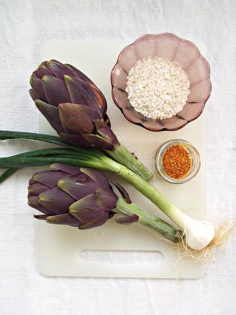 Risotto allo spumante e carciofi con noci e polvere d'arancia