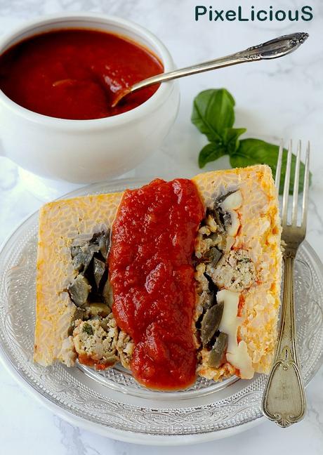 Sartù di Riso al Pomodoro con Melanzane, Provola e Polpettine di Salsiccia Sartù di Riso al Pomodoro con Melanzane, Provola e Polpettine di Salsiccia