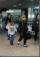 20110621-pictures-madonna-lands-heathrow-airport-01