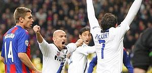 Inter Milan's Cambiasso and Pazzini celebrate as CSKA Moscow's Nababkin looks on during their Champions League soccer match CSKA Moscow at Luzhniki Stadium in Moscow CSKA-Inter 2-3