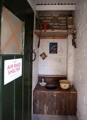 Nature calls: The original lavatory is in an old outhouse in the garden, and if you have an air raid shelter you've just got to have a gasmask ready for use - Ben keeps it in the hallway