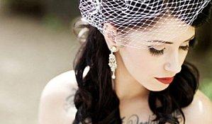 goth-bride-with-chest-tattoo-birdcage-veil-vintage-earings_.jpg