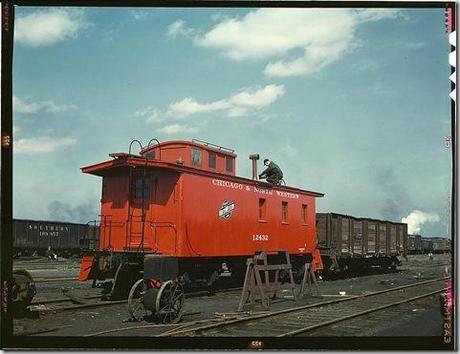Putting the finishing touches on a rebuilt caboose at the rip tracks at Proviso yard. Chicago, Illinois, April 1943. Reproduction from color slide. Photo by Jack Delano. Prints and Photographs Division, Library of Congress
