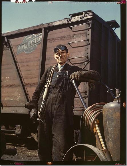 Mike Evans, a welder, at the rip tracks at Proviso yard of the Chicago and Northwest Railway Company. Chicago, Illinois, April 1943. Reproduction from color slide. Photo by Jack Delano. Prints and Photographs Division, Library of Congress