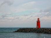 lighthouse between wind salt