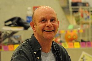 English: Nick Hornby signing books at Central ...