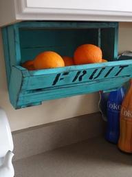 Under the cabinet fruit containers.