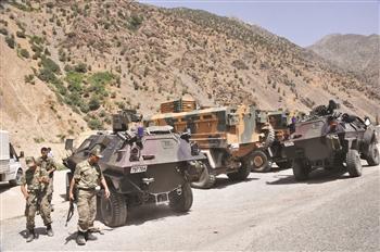 The Turkish military deploys a number of tanks and other vehicles around a military post, which has been attacked by the outlawed PKK militants in Hakkari’s Çukurca district. Nearly 130 militants were killed in the ongoing operations, a minister says. DHA photo