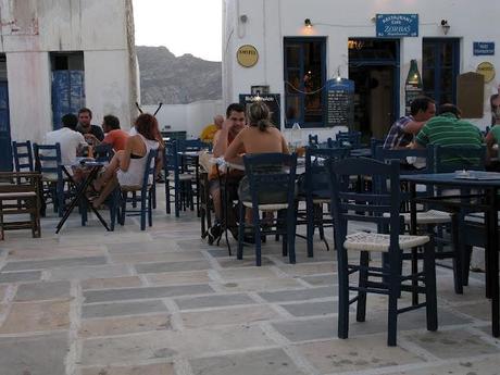 blue chaires in a white little nice square in Serifos