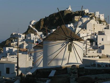 blue chaires in a white little nice square in Serifos