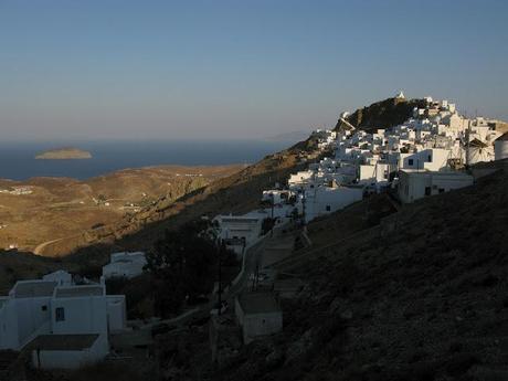 blue chaires in a white little nice square in Serifos