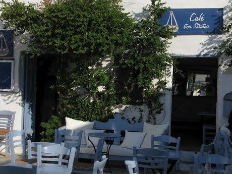 blue chaires in a white little nice square in Serifos