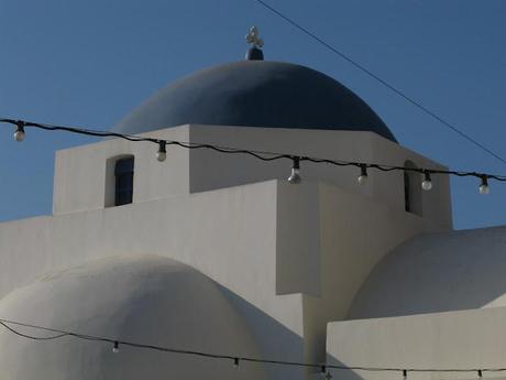 blue chaires in a white little nice square in Serifos