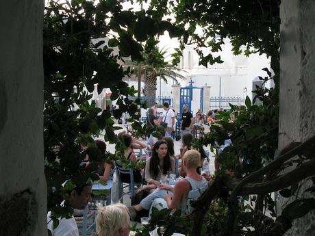 blue chaires in a white little nice square in Serifos