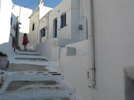 blue chaires in a white little nice square in Serifos