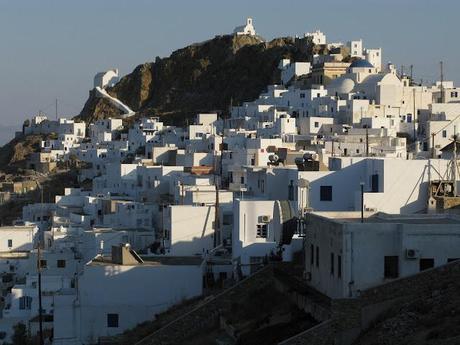 blue chaires in a white little nice square in Serifos