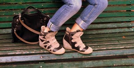 Denim, asymmetric shirt and sneakers with wedges